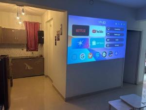 a wall with a sign in a room at Cinema Experience -Premium Studio in Karnal