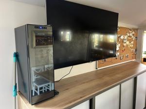 a large flat screen tv sitting on top of a counter at MAX Jazero in Trstice