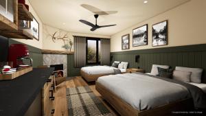 a bedroom with two beds and a ceiling fan at Tekarra Lodge in Jasper