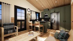 a kitchen with green cabinets and a living room at Tekarra Lodge in Jasper