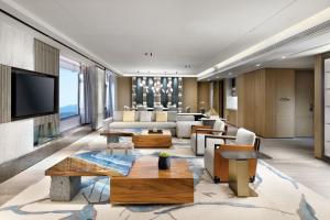 a living room filled with furniture and a flat screen tv at Crowne Plaza Beijing Badaling by IHG in Yanqing