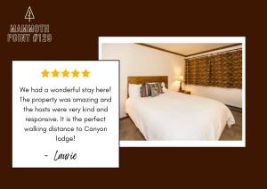 a picture of a hotel room with a bed and a sign at Mammoth Point #129 - Balcony with Mountain Views in Mammoth Lakes