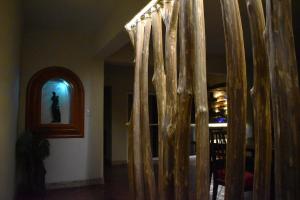 a hallway with a room with a table and a window at Departamento Loro in Manzanillo +4 photos
