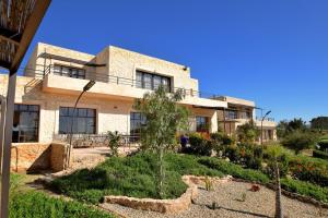 a house with a garden in front of it at Tassourt Lodge in Essaouira