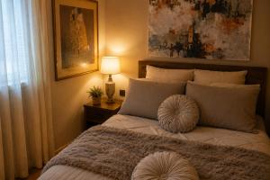 a bedroom with a bed with a pillow on it at RoseArt Nest Studio in Ljubljana