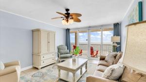 a living room with a couch and a table at Romar Tower 6B in Orange Beach