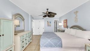 a bedroom with a bed and a ceiling fan at Romar Tower 6B in Orange Beach +48 photos