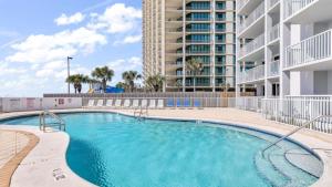 a swimming pool in a apartment with a building at Romar Tower 6B in Orange Beach
