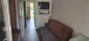 a living room with a couch and a hallway at U Julii 2 in Okuninka