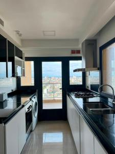 a kitchen with a view of a city at Edificio Guay I in Concepción del Uruguay