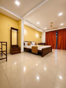 a large bedroom with a bed and a mirror at Coastal Breeze Talalla in Talalla South +76 photos