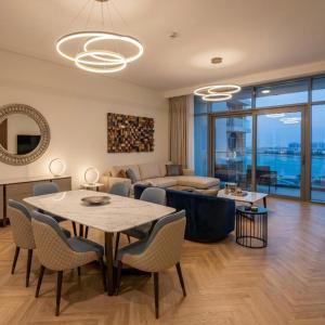 a living room with a table and a couch at V Beach in Jeddah