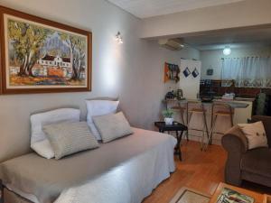 a living room with a bed and a kitchen at Piketberg Home with a View in Piketberg