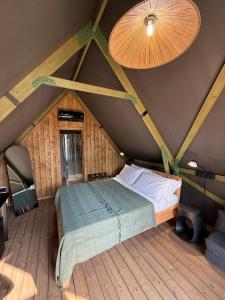 a bed in a room with a roof at Maison Di Fiore Park in Ercolano