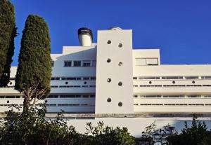 a building with a lighthouse on top of it at ÉLÉGANT STUDIO et PARKING DANS BATIMENT HISTORIQUE in Saint-Tropez
