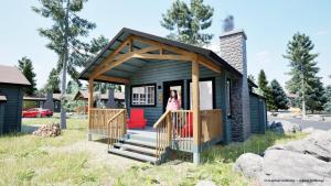 a woman standing in the doorway of a tiny house at Tekarra Lodge in Jasper