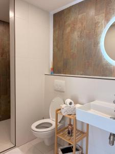 a bathroom with a toilet and a sink at Manor 2 in Stará Lesná +15 photos