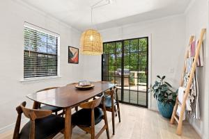 a dining room with a wooden table and chairs at Gravity Getaway in Bella Vista