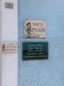 a sign on the side of a building at Villa Santa Chiara in Loreto