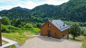 an overhead view of a wooden house in a field at Furdasówka in Szczawnica