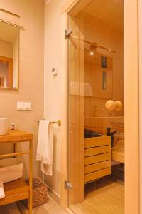 a bathroom with a shower with a glass door at Furdasówka in Szczawnica +63 photos