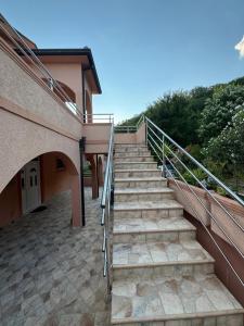 a set of stairs leading up to a building at Vila Denda Herceg Novi in Herceg-Novi +4 photos
