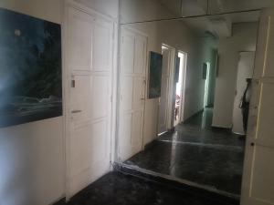 a room with white walls and a hallway with doors at Nazareth in Lima