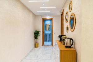 a hallway with a bathroom with a sink and a toilet at Lagoon House Dakhla in Dakhla