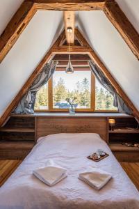 Posteľ alebo postele v izbe v ubytovaní Apartamenty Polana Sywarne Zakopane