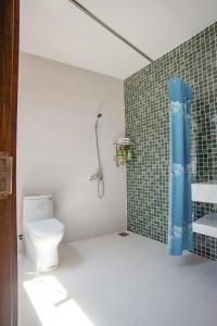 a bathroom with a toilet and a shower at 4be Cá Heo in Cầu Sông Kinh +31 photos