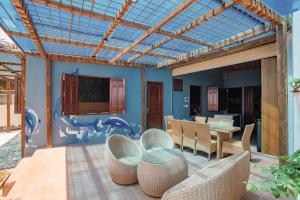 an outdoor patio with a table and chairs and a table and chairsktop at 4be Cá Heo in Cầu Sông Kinh
