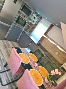a dining room table with orange slices on it at Stay4U Veszprém in Veszprém
