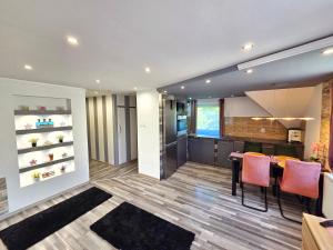 a kitchen and dining room with a table and chairs at Stay4U Veszprém in Veszprém