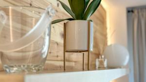 a vase with a plant in it on a shelf at Molina Molinísimo in La Molina +18 photos