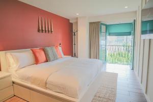 a bedroom with a large bed and a balcony at Casa México in Mexico City