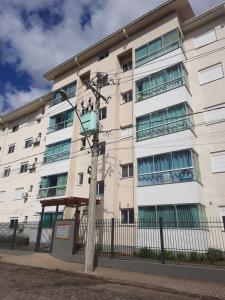 an apartment building with a street light in front of it at Meu lar na Serra Gaúcha in Nova Petrópolis