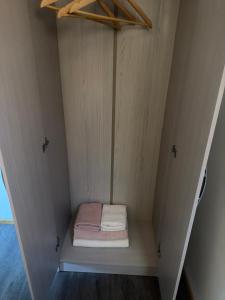 a small bed in the middle of a small room at Casa monje Patagonia in Puerto Natales