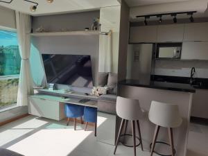 a kitchen with a table and chairs in a room at Meu lar na Serra Gaúcha in Nova Petrópolis +13 photos