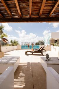 a view of the pool from the patio of a house at Hotel Zendero Tulum in Tulum