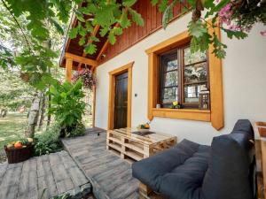 a living room with a couch and a table at Domek 2-3 osobowy in Lejno