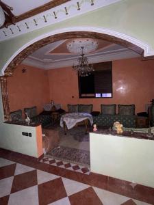 a living room with a couch and a table at MEFTAH lkhir hay nour in Safi