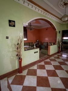 a large living room with a checkered floor at MEFTAH lkhir hay nour in Safi