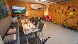 a dining room with a table and a soccer at Studio U Karolíny Nová Pec in Nová Pec