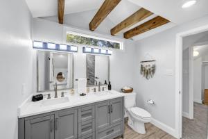 a bathroom with a sink and a toilet at Hot Tub Fire Pit 10 Min From DFW Airport in Irving +32 photos