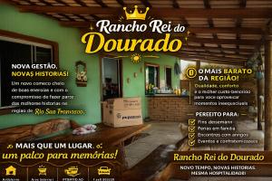 a restaurant with a sign on the side of a building at Rancho dos dourados in Três Marias +1 photo