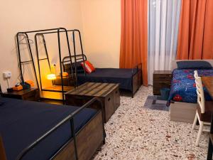 a bedroom with two bunk beds and a table at AURY HOUSE -HistoricCenter- in Cremona