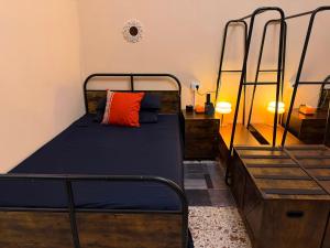 a bedroom with two bunk beds and a orange pillow at AURY HOUSE -HistoricCenter- in Cremona +16 photos