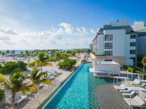 an aerial view of a resort with a swimming pool at Majestic Elegance Costa Mujeres - All Inclusive in Cancún