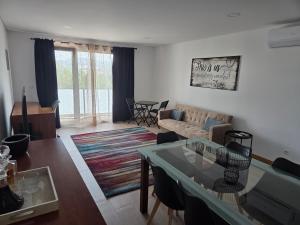 a living room with a couch and a table at Paisagem&Charme in Celorico de Basto