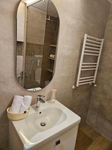 a bathroom with a sink and a mirror at Casa marsa in Gammarth